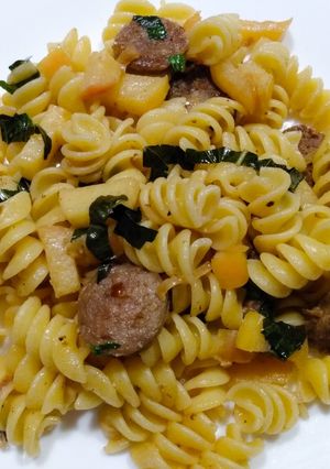 A picture of Rotini with sausage and apples.