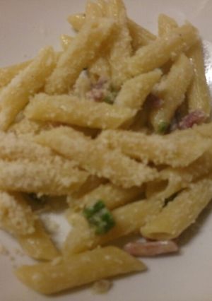 A picture of Pasta with asparagus and speck.