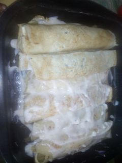 Una foto de Canelones de acelga y carne picada