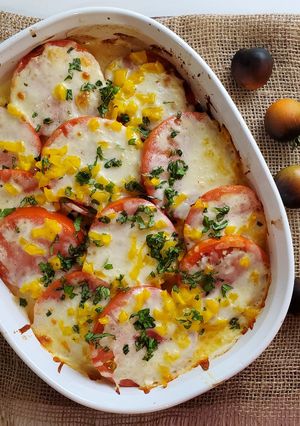 A picture of Grilled Tomatoes with cheese.