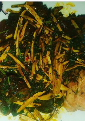 A picture of Ugba mixed with vegetable.