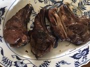 A picture of lamb chops with mint