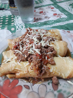 Una foto de Canelones de acelga con salsa bolognesa 🍽