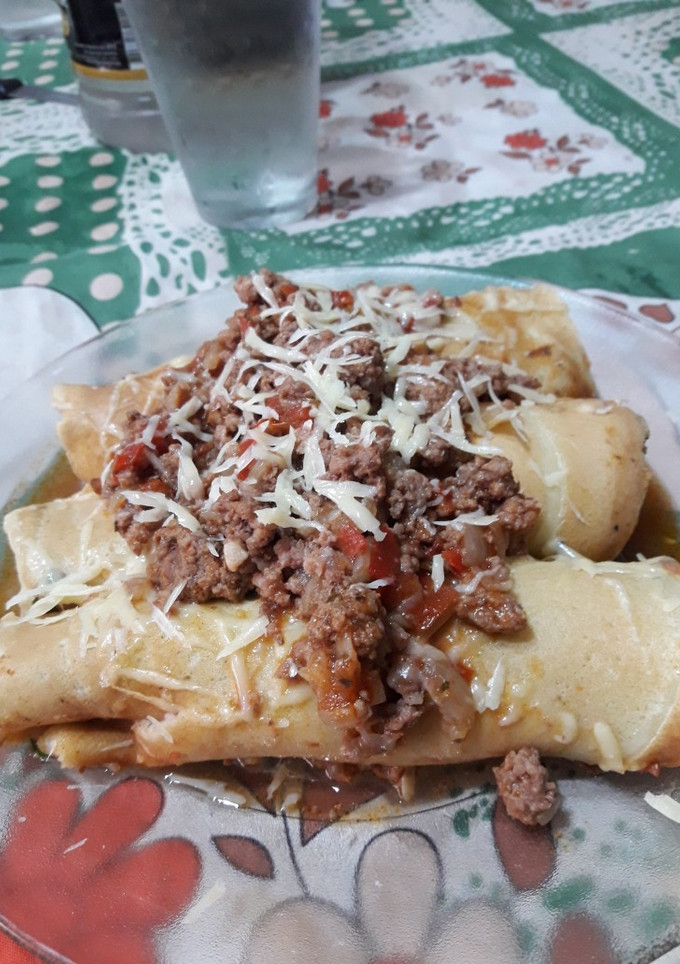 Una foto de Canelones de acelga con salsa bolognesa 🍽