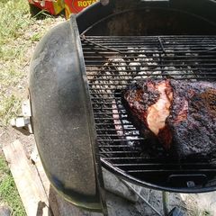 Smoked pork shoulder on the webber A picture of Smoked pork shoulder on the webber.