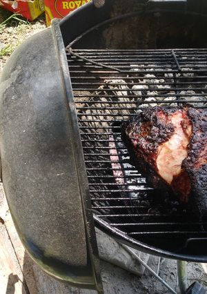A picture of Smoked pork shoulder on the webber.