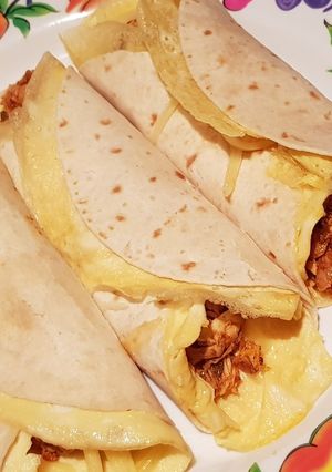 A picture of Curry Chicken Egg Cheese Tortilla Wrap.