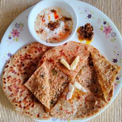 A picture of Stuffed paratha with leftover rice.