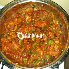 A picture of Spicy chicken in a pan.