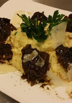 A picture of Bianco Meats-Grilled Bourbon Steak Tips on Creamy Parm Polenta !.