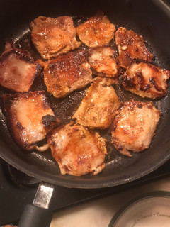 A picture of Pan fried thin pork chops.