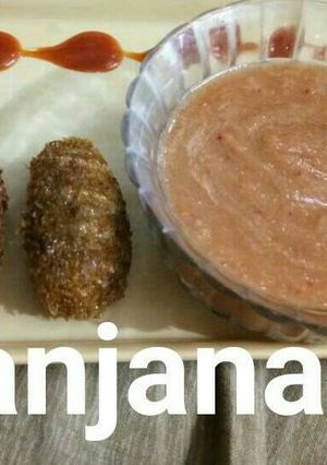 A picture of Instant raw mango chutney with leftover rice nuggets.