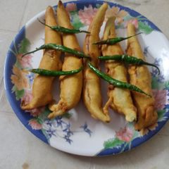 A picture of Big green chillies pakoda. (mirchi bhajji).