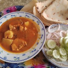 Chicken aloo ka salan with roti A picture of Chicken aloo ka salan with roti.
