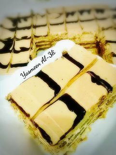 صورة لوصفة طبقات البسكوت بالشوكولاته والنسكافيه 🌸