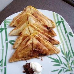 A picture of Toast bread with chocolate spread & mayo.