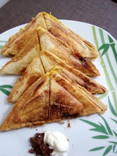 A picture of Toast bread with chocolate spread & mayo.