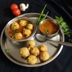A picture of Rasam vada.