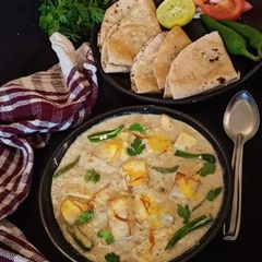 A picture of Nawabi Paneer Korma in white Gravy.
