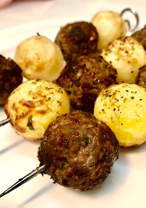 A picture of Grilled Kofta and Potato Balls.