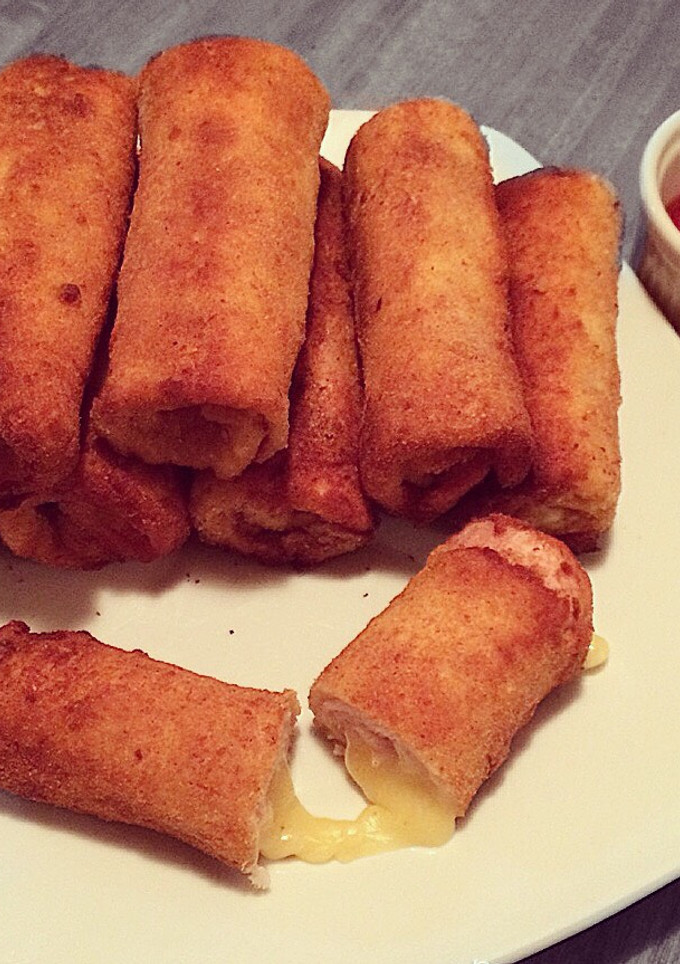 Una foto de Flamenquines con pan molde de queso y jamón