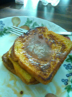 A picture of French toast with caramel sauce.