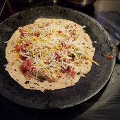 A picture of Cheesy masala papadam.