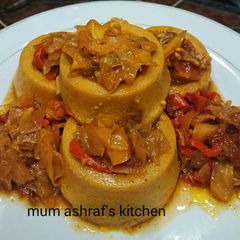A picture of Moi moi wt cabbage sauce.