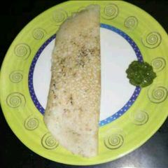 A picture of Paper dosa with sesame seeds.