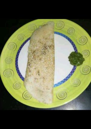 A picture of Paper dosa with sesame seeds.