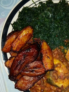 A picture of Porridge beans veggie with Titus fish and fried plantain.