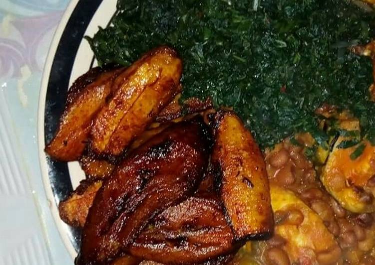 Porridge beans veggie with Titus fish and fried plantain