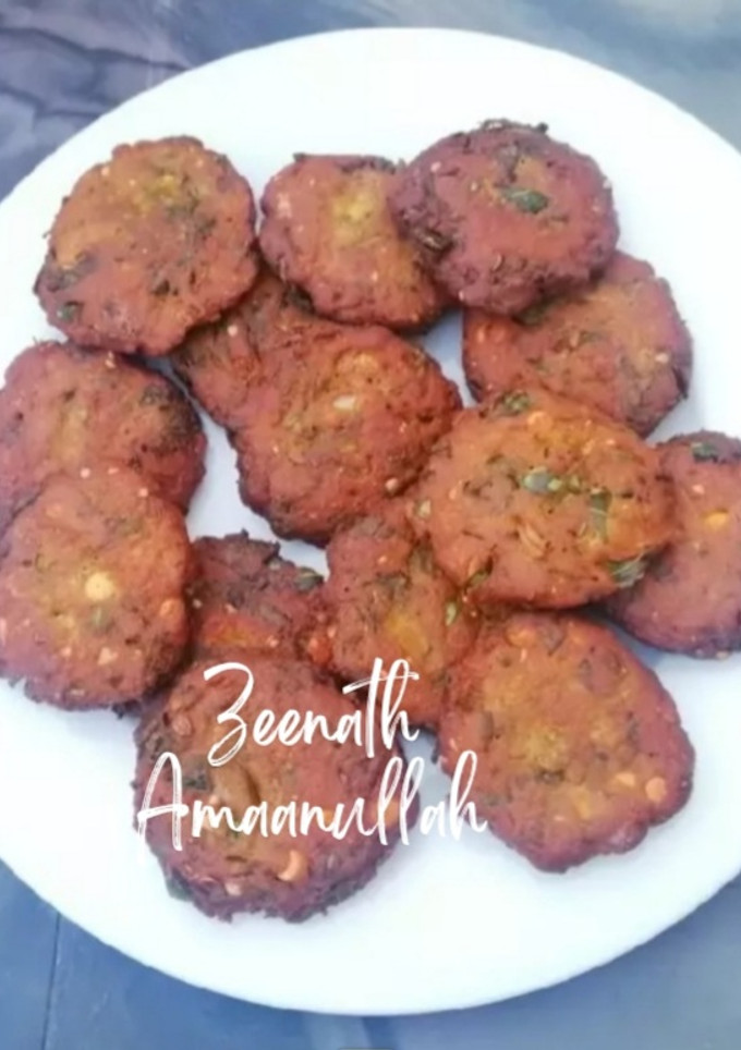 A picture of Dal Vadas with Spring Onions.