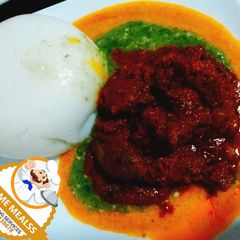 A picture of Ground rice with Okro and assorted beef and Chicken.