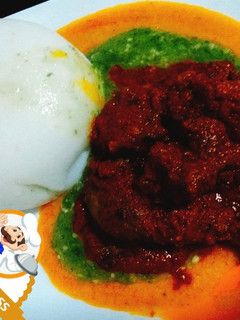 A picture of Ground rice with Okro and assorted beef and Chicken.
