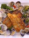 Pan fried sea bream with sake braised clams and broccolini