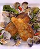 Pan fried sea bream with sake braised clams and broccolini