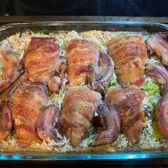 A picture of Baked Quail Breasts on Bed of Rice and Broccoli.