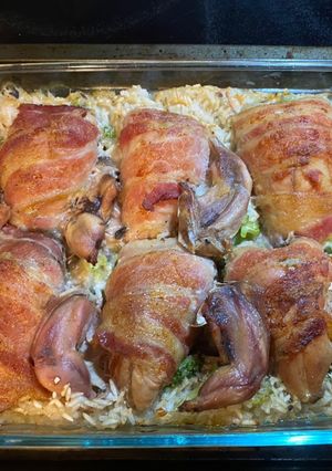 A picture of Baked Quail Breasts on Bed of Rice and Broccoli.