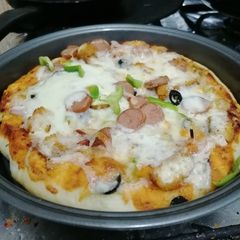 A picture of Pizza pepperoni and chicken Nuggets.