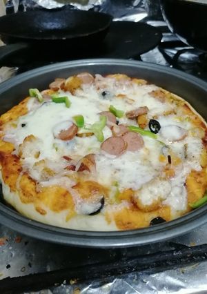 A picture of Pizza pepperoni and chicken Nuggets.