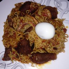 A picture of Native jollof Noodles, with kpomo and dried Prawns.