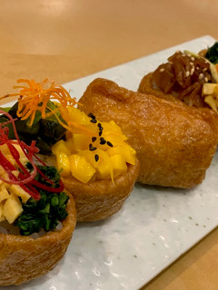 A picture of Inari Sushi / Sushi rice wrapped in a tofu bag. Good for Vegan.