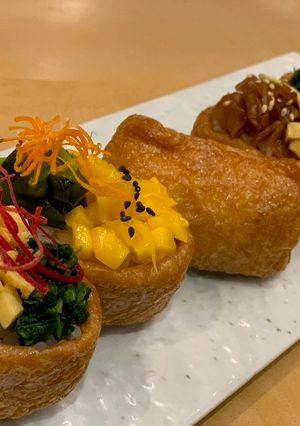 A picture of Inari Sushi / Sushi rice wrapped in a tofu bag. Good for Vegan.