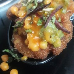 A picture of Aloo (potato) tikki chat.