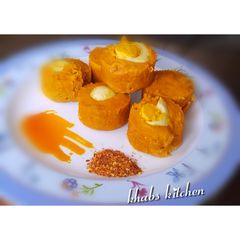 A picture of Moi moi with samosa fillings and egg.