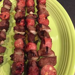 A picture of Steak and sausage kabobs.