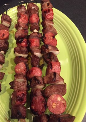 A picture of Steak and sausage kabobs.