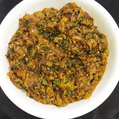 A picture of Roasted Baingan(Eggplant) Ka Bharta Masala 🍆.