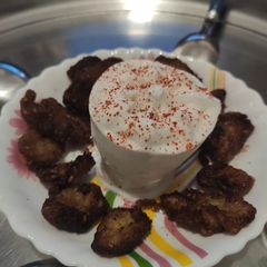 A picture of Fried banana with Vanilla icecream.